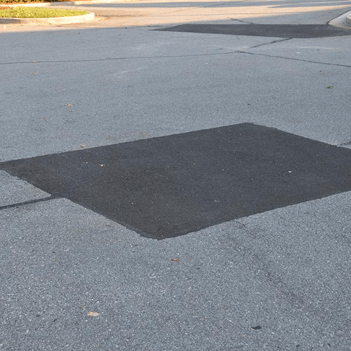 asphalt patching img