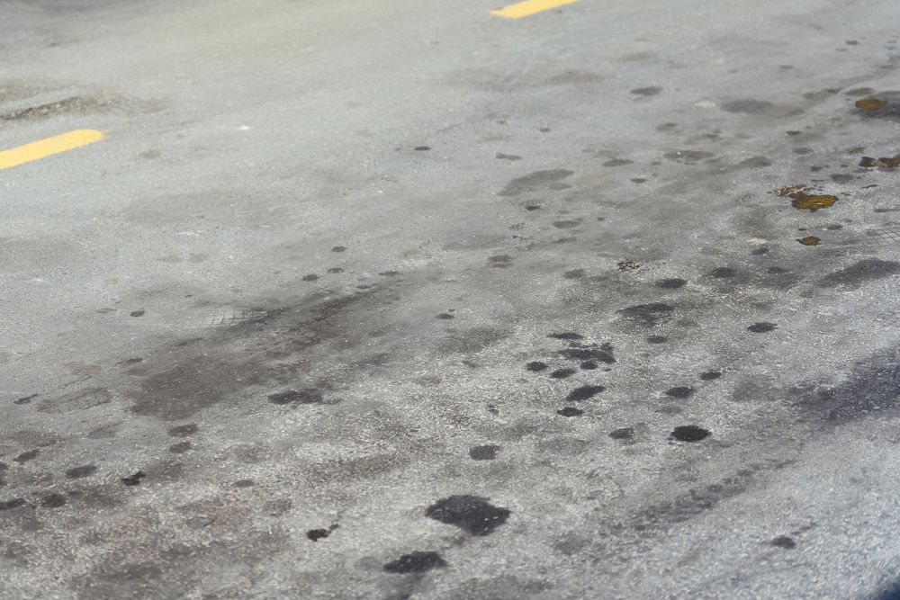 Stains,On,The,Road,From,The,Car,Oil.,Black,Oil